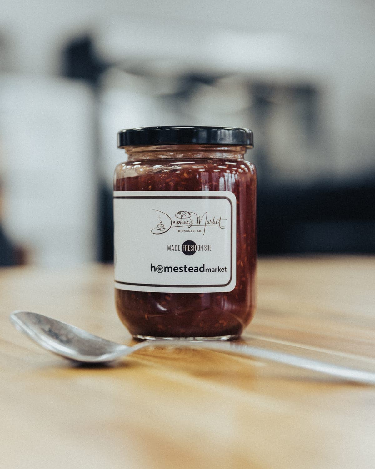 Jar of jam with a custom Daphne's Market and Homestead Market label