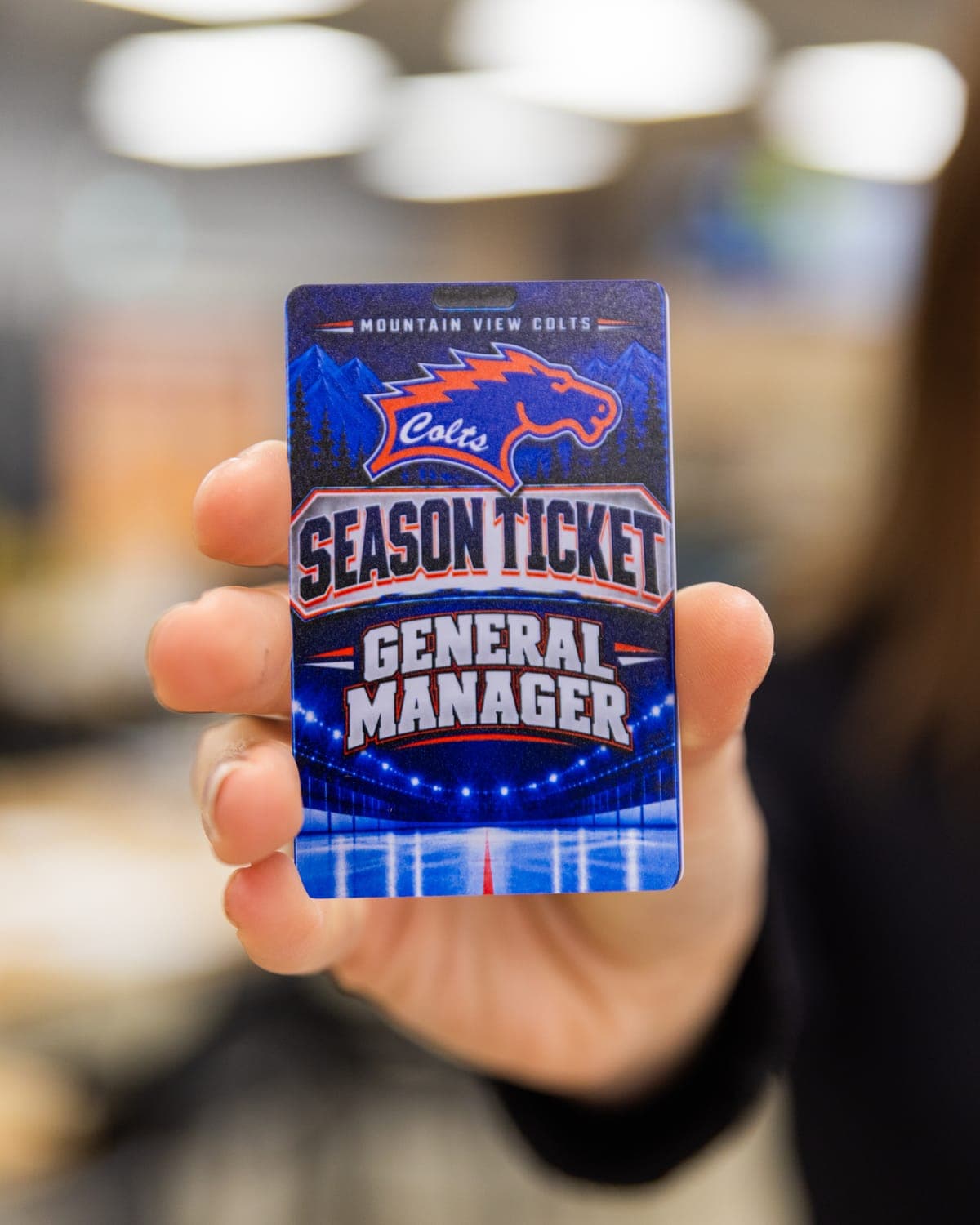 Mountain View Colts season ticket pass held up to the camera